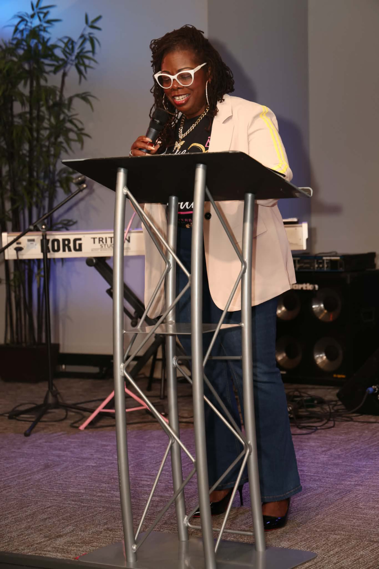 Minister Rose CiConta speaking at a podium